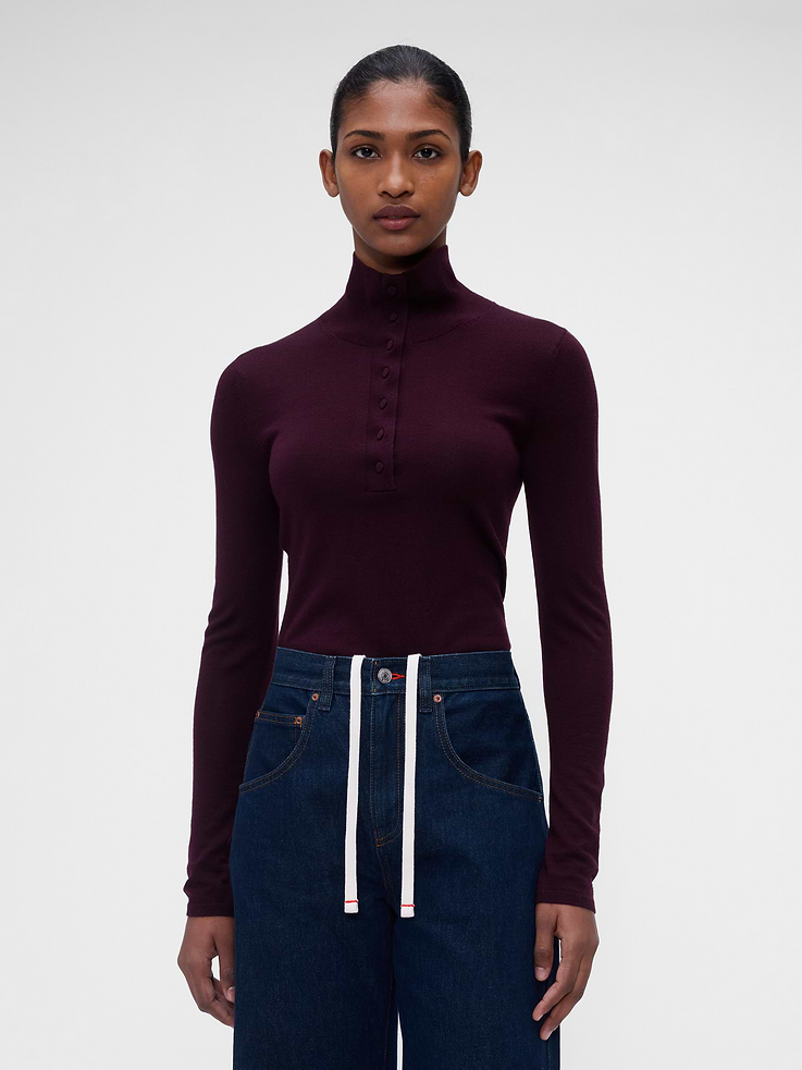 Image 1 of 5, Soft Merino wool sweater. In a slim fit., Turtleneck with button detailing., Long sleeves., Ribbed hem and cuffs., This product contains 100% RWS-certified wool, certified by Control Union (CU 893801), which verifies animal welfare and land management requirements and tracks the certified wool fiber from farm to final product., This product was made in a factory that invests in gender equity and women’s empowerment through RISE. Learn more at gapinc.com/equity ., Product #1183572