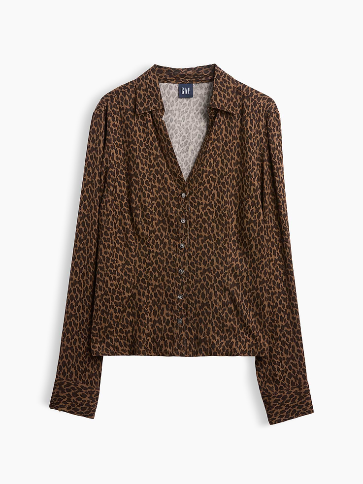 Image 1 of 3, Smooth rayon satin fitted shirt. In a slightly cropped length., Spread collar, v-neck., Long sleeves with button cuffs., Button front., Princess darts at front and back., This product was made in a factory that invests in gender equity and women’s empowerment through RISE. Learn more at gapinc.com/equity ., Product #1184283
