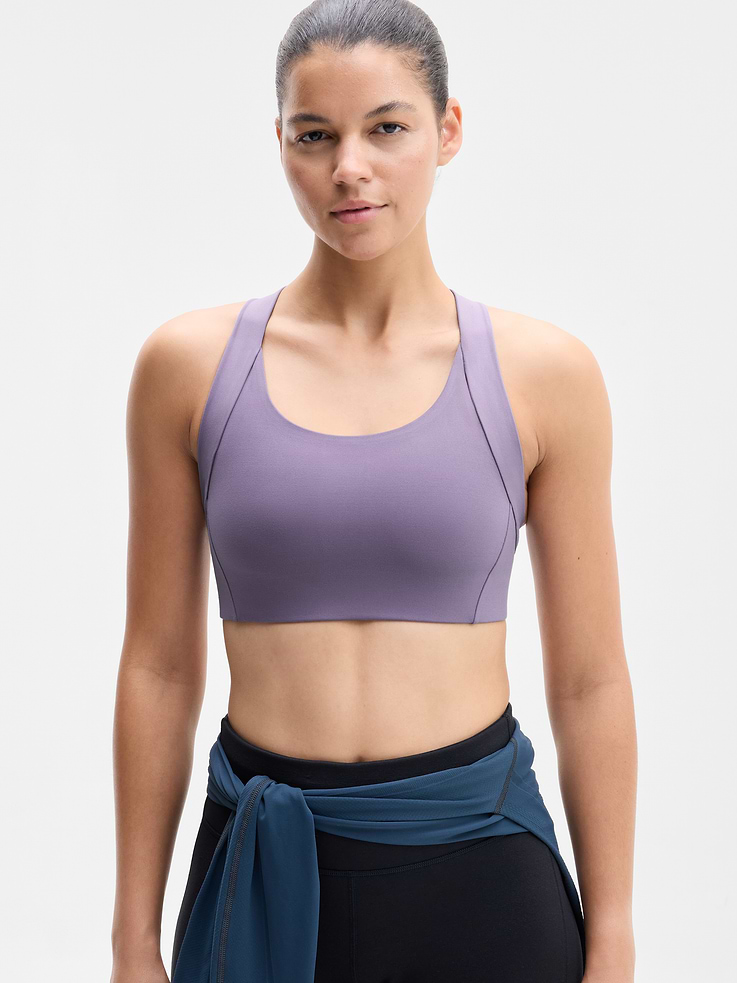 Image 1 of 4, BEST FOR CARDIO: run + train + HIIT, IMPACT: Medium-impact workouts, best for A-C cups, FEEL: PowerMove fabric is sleek, weightless, and helps keep you cool with quick-drying properties, FAVE: Back mesh detail offers optimal breathability, Built-in pockets with removable pads for optional coverage, Product #1178724