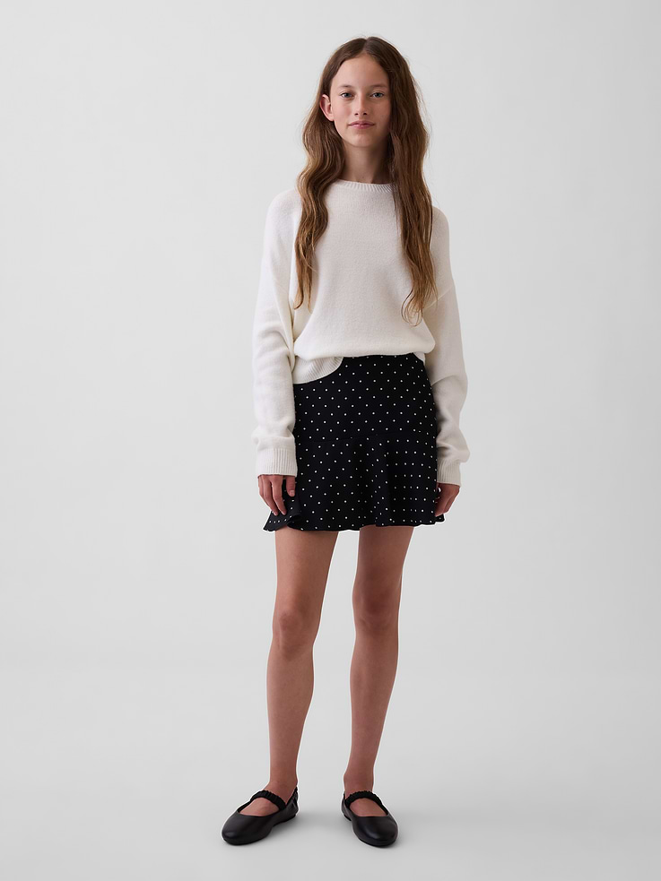 Image 1 of 4, Soft satin mini skirt., Zipper with hook-and-eye closure at side seam., Tiered design., Allover polka dots., This product was made in a factory that invests in gender equity and women’s empowerment through RISE. Learn more at gapinc.com/equity ., Product #1194793