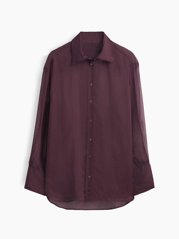 Image 1 of 2, Our oversized shirt pulled straight from the archives. Always easy. Forever iconic., Sheer organza oversized shirt., Point collar, button front., Long sleeves with button cuffs., This product was made in a factory that invests in gender equity and women’s empowerment through RISE. Learn more at gapinc.com/equity ., Product #1184603