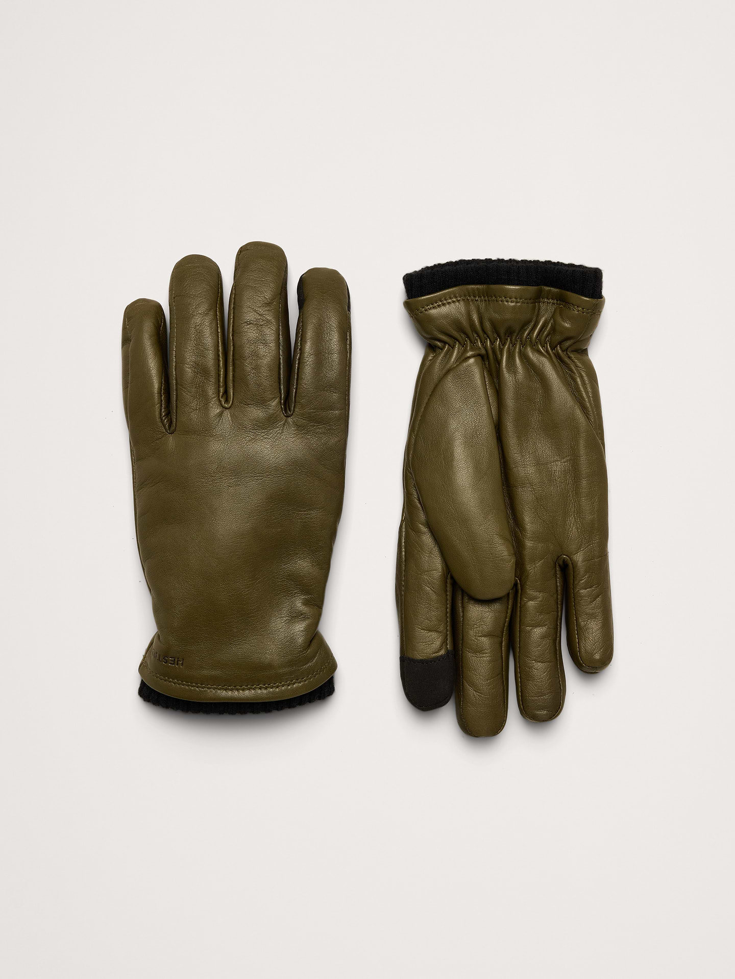 Image 1 of 3, A warm, minimalist glove with a pre-curved construction to allow for better dexterity. PrimaLoft Gold insulation keeps you warm on the coldest of days., Hestra: Family-run since 1936, crafting high-quality gloves in Sweden for all hand—from lumberjacks to skiers and now to you., Touchscreen functionality on the index and thumb., Fleece lining., Product #1180429