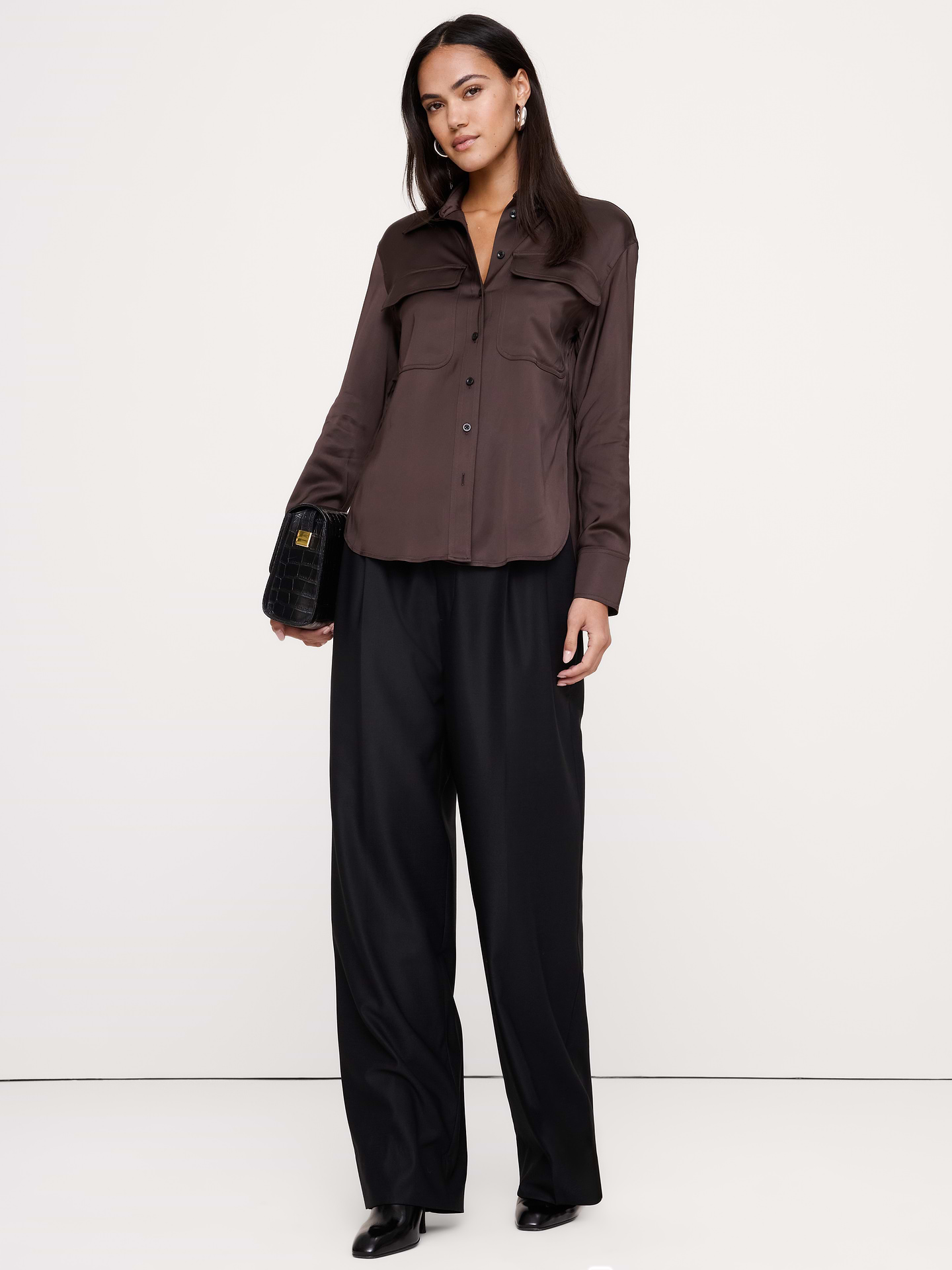 Image 1 of 8, An exploration of luxe utility, this oversized shirt has chest pockets for a utilitarian twist on the classic button-down shirt. Cut in a beautiful stretch-satin fabric., Oversized fit: Extra room through chest, shoulders, and waist. Dropped shoulder seams., Point collar with button front., Chest pockets., Shirttail hem., Product #1183797