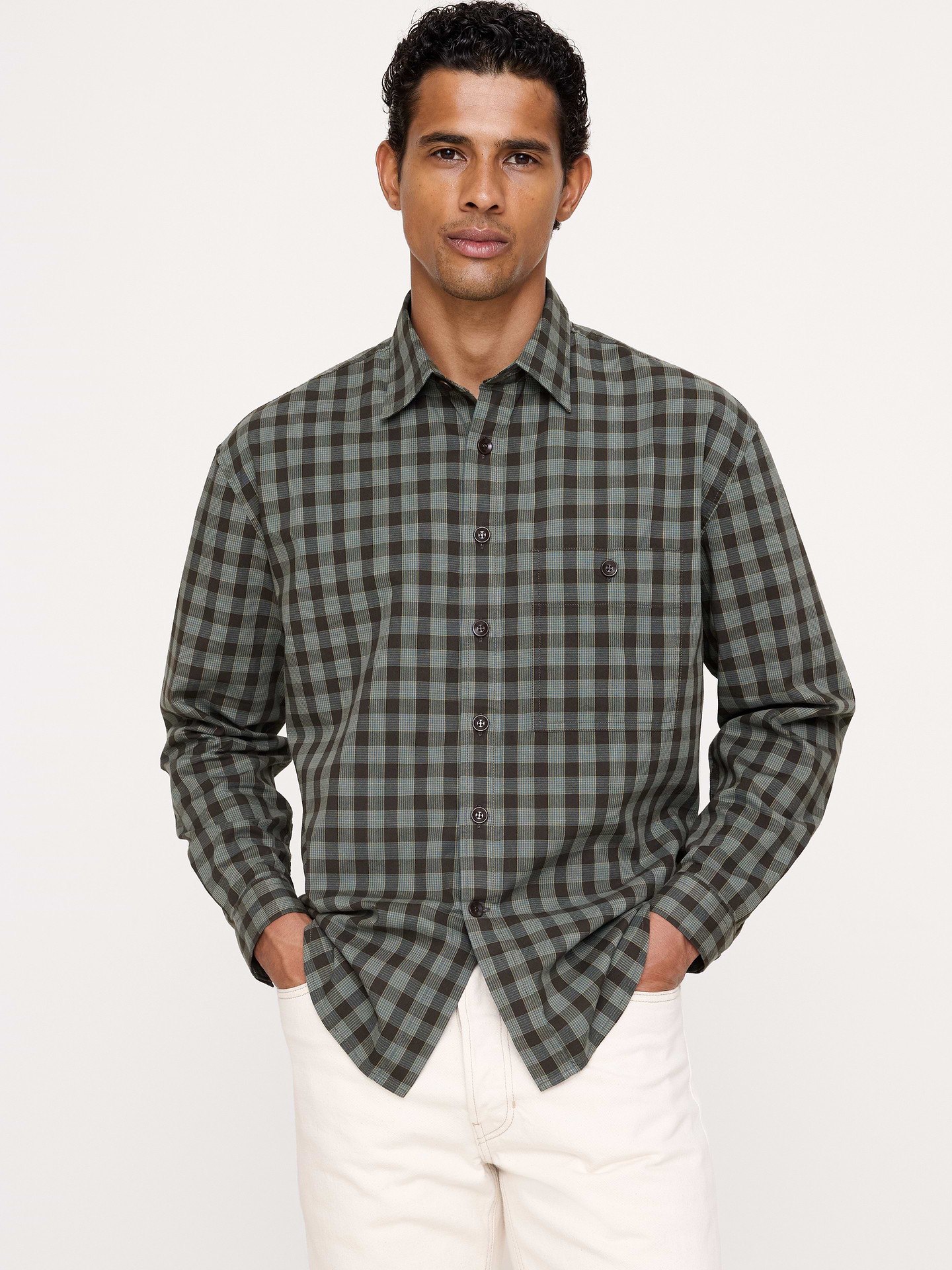 Image 1 of 8, Our best-selling Poplin Shirt, now in a relaxed silhouette, specially washed for a lived-in softness. Iron it for a crisp finish, or skip for a slightly rumpled, casual look., Relaxed Fit: A straight & roomy fit with a dropped shoulder seam., Spread collar with button-front closure., Chest pocket., Shirttail hem., Product #892582