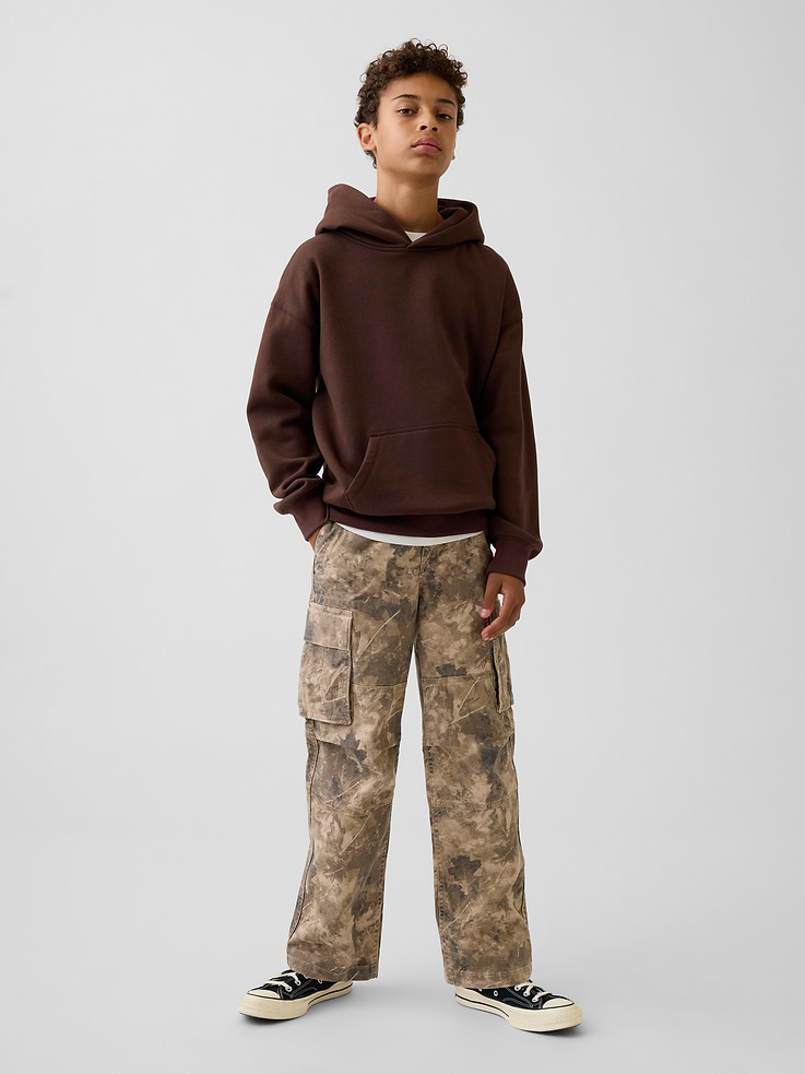 Image 1 of 5, Smooth stretch cotton twill cargo pants. In a loose fit., Button closure at adjustable waist (sizes 4-8 have a hook & bar closure beneath faux snap for easy on and off), zip fly., Side slant pockets, back welt pockets., Flap patch cargo pockets with snap closure at sides., Seaming detail at knees., Certain style have an allover camo print., Responsibly Made: This pair of pants is part of our water-saving Washwell program. Compared with conventional wash methods, Washwell uses at least 20% less water., Product #911808