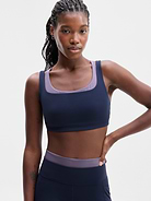 Image 1 of 3, BEST FOR STUDIO: yoga + barre + pilates, IMPACT: Light-impact workouts, best for D-DD cups, FEEL: Powervita fabric is buttery soft with support that feels like a gentle hug, FAVE: Double-layered for added coverage, plus four cross-back straps for balanced support, Pad-free design gives light, low-profile support, Product #603748