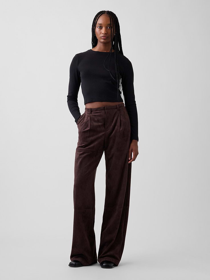 Image 1 of 6, Soft vegan suede wide-leg pants. In a relaxed fit and mid rise., Concealed hook and bar closure, zip fly., Pleated front., Elasticized back waist., Side slant pockets, back welt pockets., Horizontal leg seams., This product was made in a factory that invests in gender equity and women’s empowerment through RISE. Learn more at gapinc.com/equity ., Product #1184737