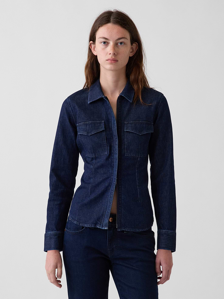 Image 1 of 5, Low-stretch denim fitted full-zip shirt., Spread collar., Long sleeves with button cuffs., Hidden zipper front., Chest flap patch pockets., Front and back waist darts., Dark indigo wash., Responsibly Made: This denim shirt is part of our water-saving Washwell program. Compared with conventional wash methods, Washwell uses at least 20% less water., Responsibly Made: This pair of jeans is part of our water-saving Washwell program. Compared with conventional wash methods, Washwell uses at least 20% less water. More Sustainable Cotton: Made with 5% recycled cotton. Compared to virgin materials, using recycled materials helps reduce resource use and waste., This product was made in a factory that invests in gender equity and women’s empowerment through RISE. Learn more at gapinc.com/equity ., Product #1184818