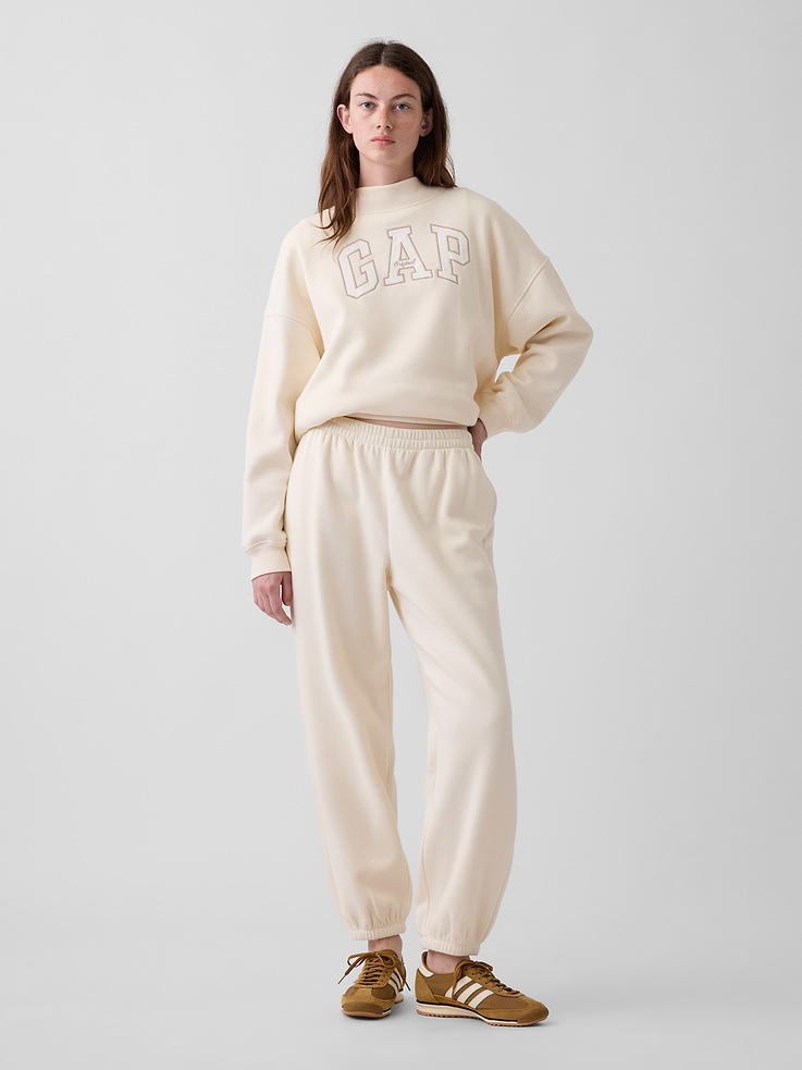 Image 1 of 6, Soft cotton-blend fleece joggers in a relaxed fit., Elasticized waist with inner drawcords., Side on-seam pockets., Elasticized cuffs., Made with 23% recycled polyester. Compared to virgin materials, using recycled materials helps reduce resource use and waste., Explore our GapSweats Guide ., Product #903064