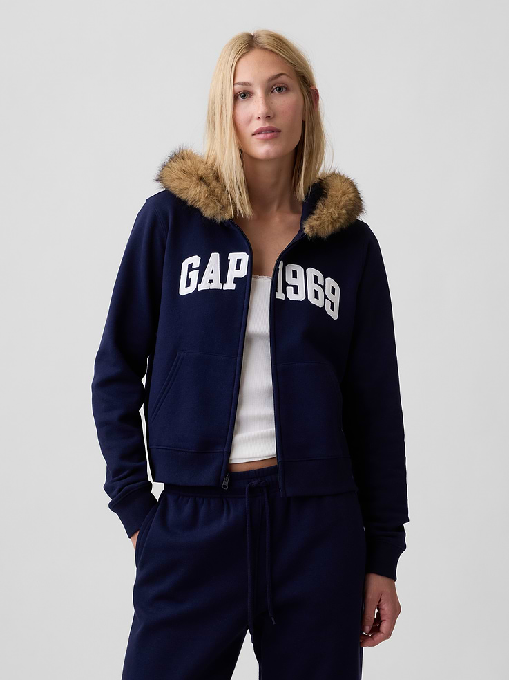 Image 1 of 5, This product is made with/contains 23% recycled polyester. Compared to virgin materials, using recycled materials helps reduce resource use and waste., Soft, comfy fleece., Long sleeves with banded cuffs., Faux-fur lining at hood, zip front., Gap 1969 logo at front., Kanga pockets., Banded hem., This product was made in a factory that invests in gender equity and women’s empowerment through RISE. Learn more at, Product #1184655