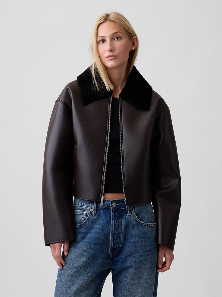 Image 1 of 5, Smooth faux leather., Dropped shoulder, long sleeves., Knit spread collar, zip front., Front slant pockets., This product was made in a factory that invests in gender equity and women’s empowerment through RISE. Learn more at, Product #1185213