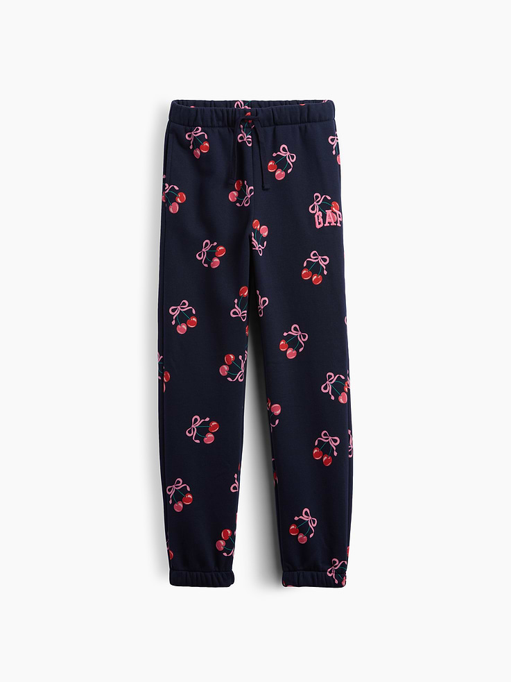 Image 1 of 3, This product is made with/contains at least 23% recycled polyester. Compared to virgin materials, using recycled materials helps reduce resource use and waste., Soft, comfy fleece., Drawcord ties at elasticized waist., On-seam pockets., Gap logo at hip., Elasticized cuffs., Select styles have allover print., This product was made in a factory that invests in gender equity and women’s empowerment through RISE. Learn more at, Product #1178436