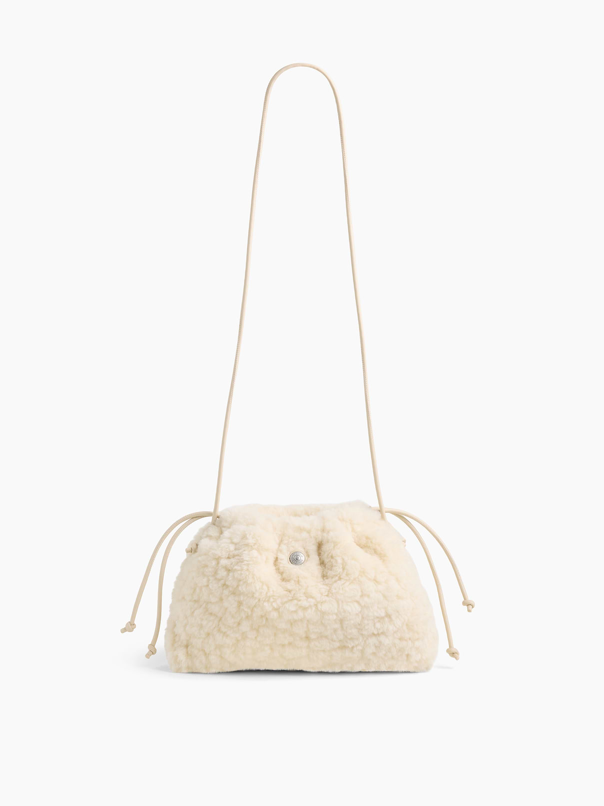 Image 1 of 6, Soft sherpa pouchette bag., Worn hand-held, crossbody or over-the-shoulder., Vegan leather shoulder strap., Drawcord closure at top., Product #1186132
