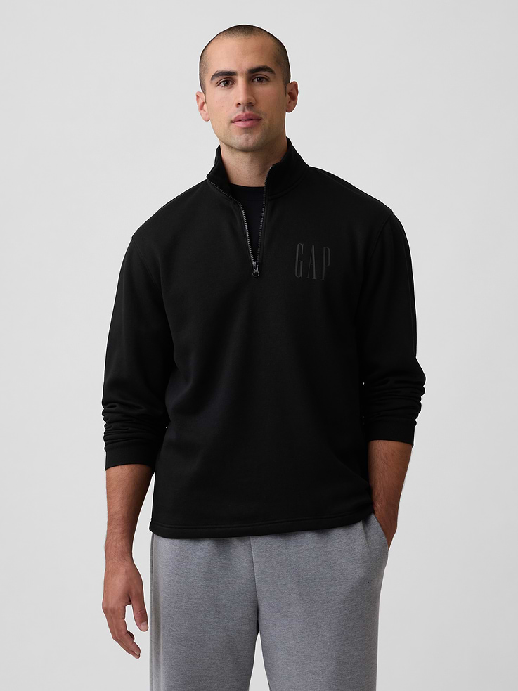 Image 1 of 4, This product is made with/contains 42% recycled polyester. Compared to virgin materials, using recycled materials helps reduce resource use and waste., Soft, comfy fleece., Dropped shoulder, long sleeves with banded cuffs., Stand collar, quarter-zip front., Select styles have Gap graphic or logo at chest., This product was made in a factory that invests in gender equity and women’s empowerment through RISE. Learn more at, Product #1189433