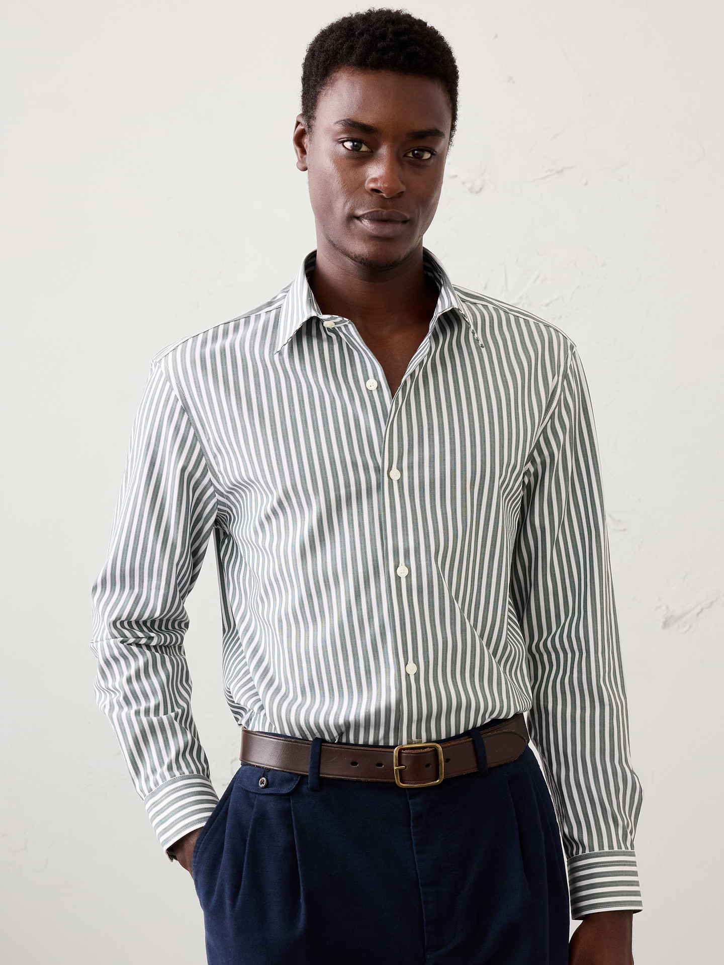 Image 1 of 8, WRINKLE RESISTANT: No need to iron, these soft, cotton dress shirts are specially engineered to resist wrinkles so it stays looking crisp and pulled-together., Spread collar. Long sleeves with adjustable double-button barrel cuffs and button vents., Clean front., Shirttail hem., Made exclusively for Banana Republic Factory., Product #1175945