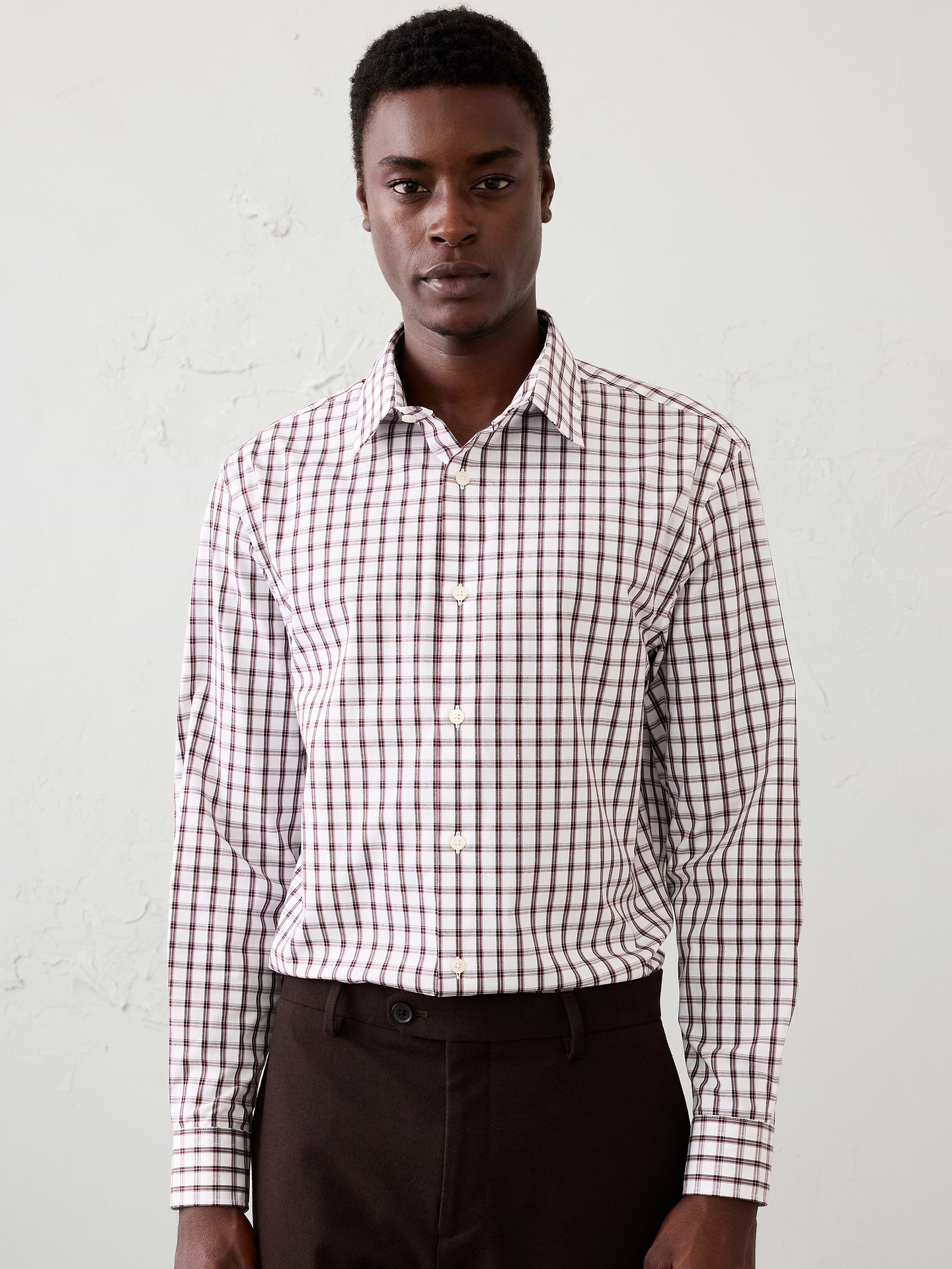 Image 1 of 8, WRINKLE RESISTANT: No need to iron, these soft, cotton dress shirts are specially engineered to resist wrinkles so it stays looking crisp and pulled-together., Spread collar. Long sleeves with adjustable double-button barrel cuffs and button vents., Clean front., Shirttail hem., Made exclusively for Banana Republic Factory., Product #1175945