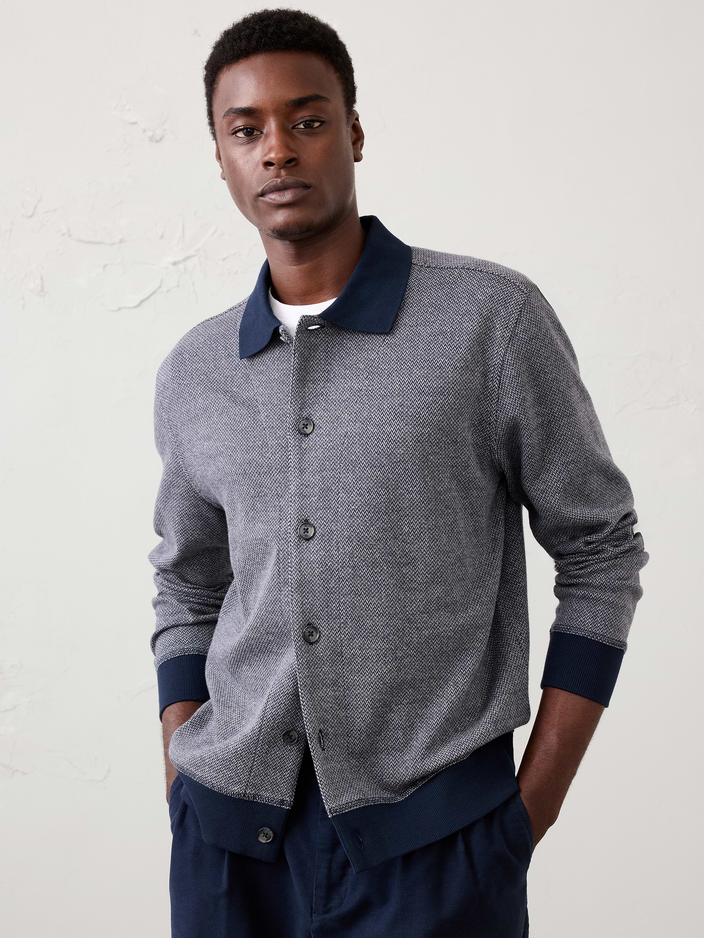 Image 1 of 3, Crafted from a unique knit herringbone fabric, this polo cardigan delivers rich texture and subtle dimension with a refined feel. Balancing the ease of a cardigan with the polish of a polo silhouette, it's a versatile layer that transitions effortlessly from casual to elevated occasions., Ribbed knit polo collar. Long sleeves with ribbed knit cuffs., Button-front closure., Ribbed knit hem., Back yoke seam., Made exclusively for Banana Republic Factory., Product #1181070