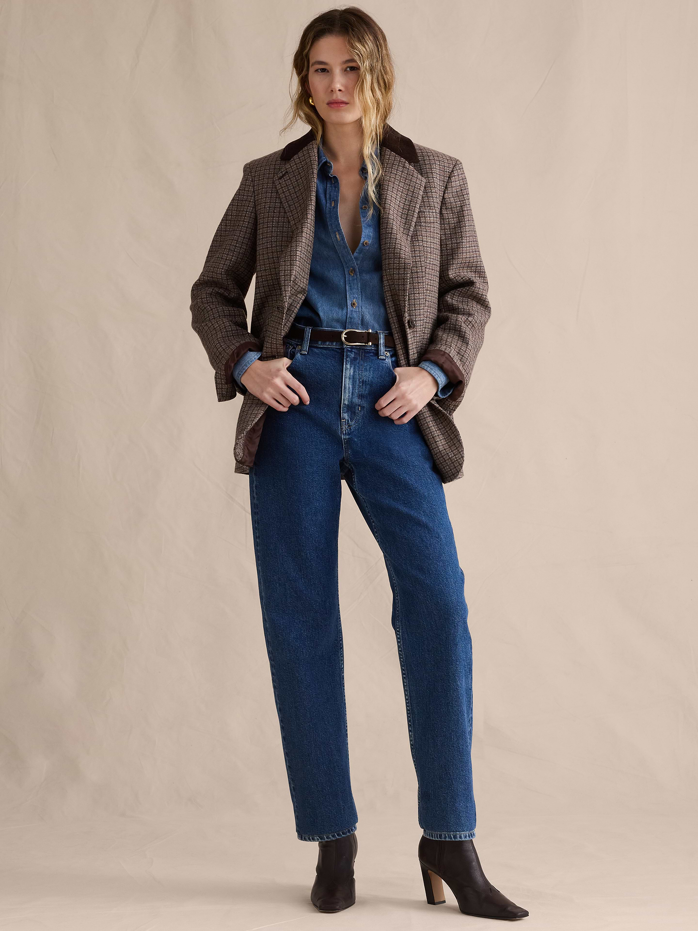 Image 1 of 8, A nod to the 90s. These straight-leg jeans have a high-rise and stovepipe-straight fit through the leg. Our designers selected a soft denim with stretch for comfort., High-Rise 90s Straight Fit: High-rise (12"). Fitted through waist, hip, and thigh with a straight leg. Full length., Zip fly with button closure. Belt loops., Five-pocket styling., Leather or suede brand patch at back waistband., Product #825196