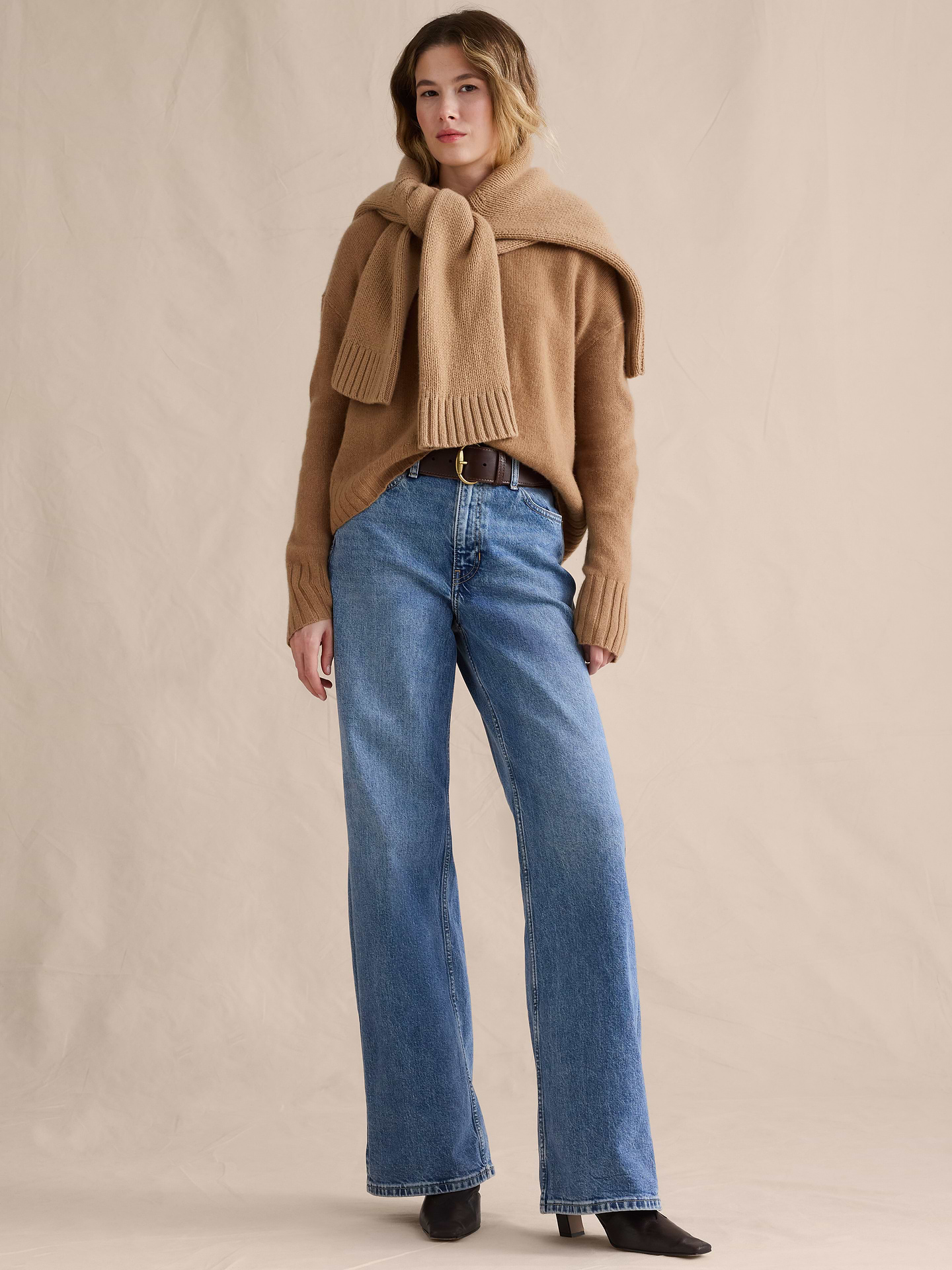 Image 1 of 8, Our Icon Wide-Leg jean has a leg-lengthening silhouette that's fitted at the waist and hips. Crafted in comfort-stretch denim woven from cotton and super-soft TENCEL™ lyocell., Icon Wide-Leg Fit: High rise (11.5"). Fitted through hip and thigh with a wide leg. Full length., Zip fly with button closure. Belt loops., Five-pocket styling., Leather or suede brand patch at back waistband., Product #826977