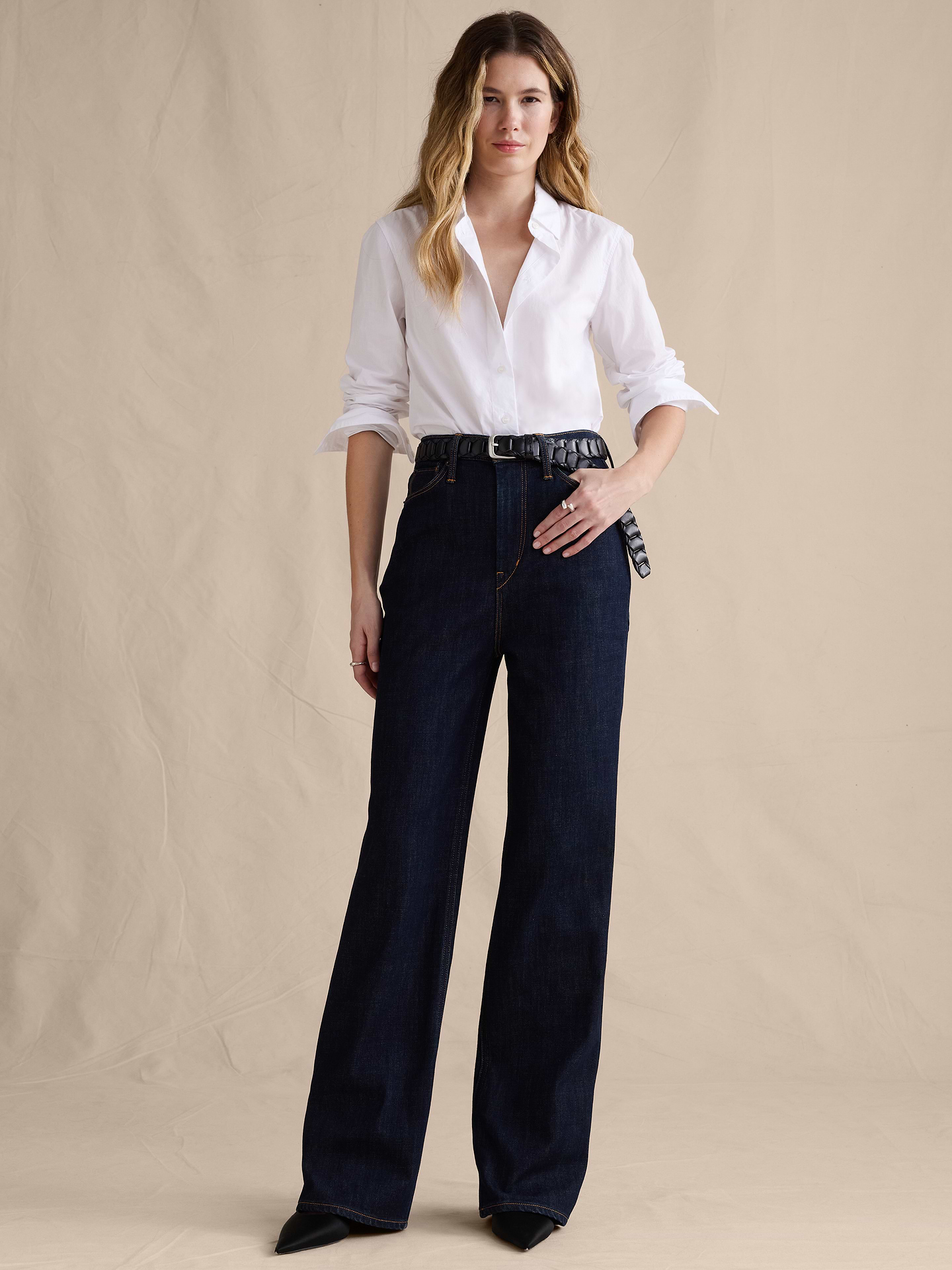 Image 1 of 8, Our Icon Wide-Leg jean has a leg-lengthening silhouette that's fitted at the waist and hips. Crafted in comfort-stretch denim woven from cotton and super-soft TENCEL™ lyocell., Icon Wide-Leg Fit: High rise (11.5"). Fitted through hip and thigh with a wide leg. Full length., Zip fly with button closure. Belt loops., Five-pocket styling., Leather or suede brand patch at back waistband., Product #826977