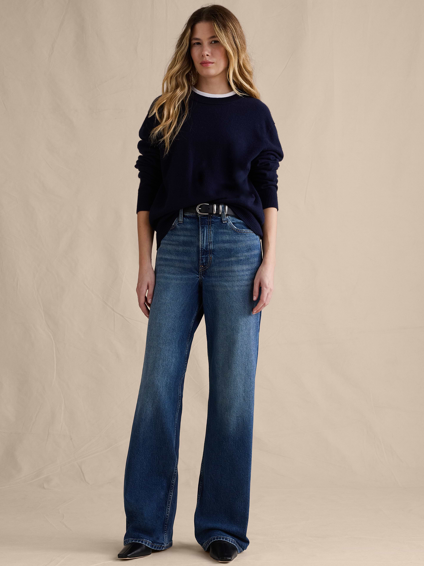 Image 1 of 8, Our Icon Wide-Leg jean has a leg-lengthening silhouette that's fitted at the waist and hips. Crafted in comfort-stretch denim woven from cotton and super-soft TENCEL™ lyocell., Icon Wide-Leg Fit: High rise (11.5"). Fitted through hip and thigh with a wide leg. Full length., Zip fly with button closure. Belt loops., Five-pocket styling., Leather or suede brand patch at back waistband., Product #826977