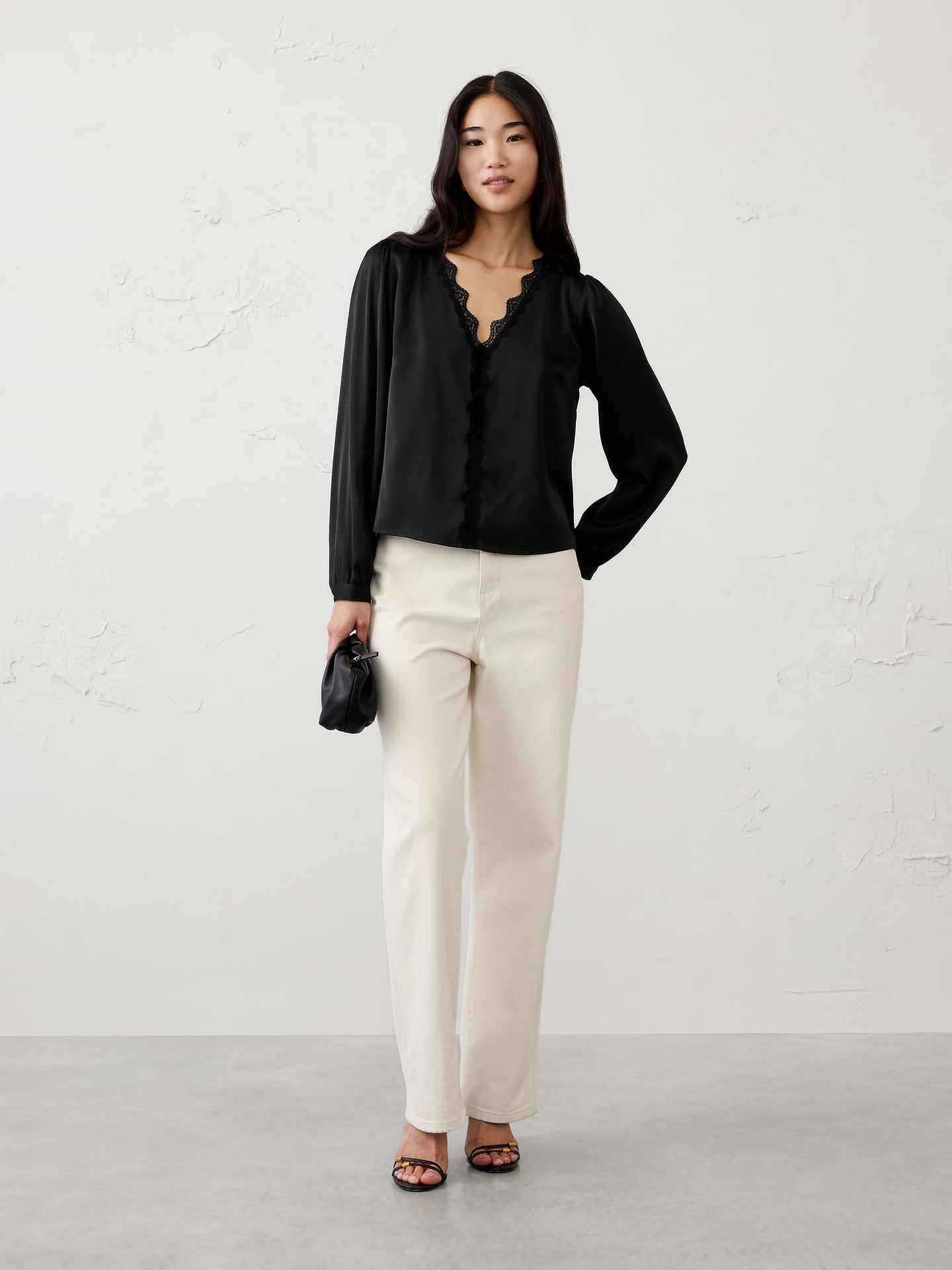 Image 1 of 5, Romantic lace details bring an elevated feel to this feminine blouse, making it a perfect choice for holiday celebrations and special occasions. Delicate trim and soft draping create an effortlessly polished look that transitions beautifully from dinner parties to evening events., V‑neckline. Long blouson sleeves with buttoned cuffs., Scalloped lace trim frames the neckline extending down the front., Made exclusively for Banana Republic Factory., Product #1185900