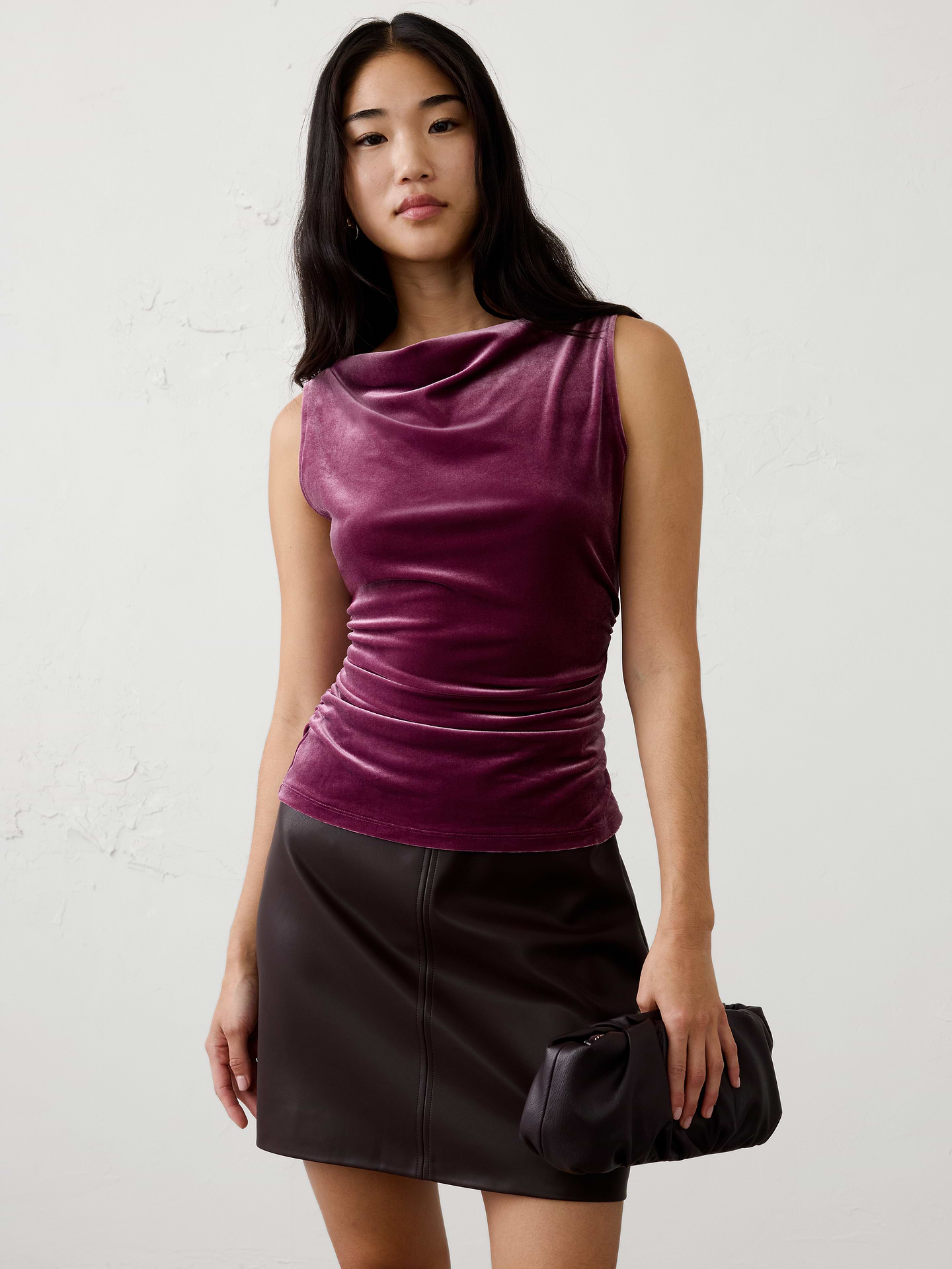 Image 1 of 4, Made from our ultra‑soft knit velvet, this top combines luxurious texture with effortless comfort. Side ruching creates a flattering, shape‑enhancing fit, while the rich velvet finish makes it the perfect piece to elevate your festive wardrobe., Straight neckline. Sleeveless., Side shirring at waist., Fitted at the waist., Made exclusively for Banana Republic Factory., Product #1186014