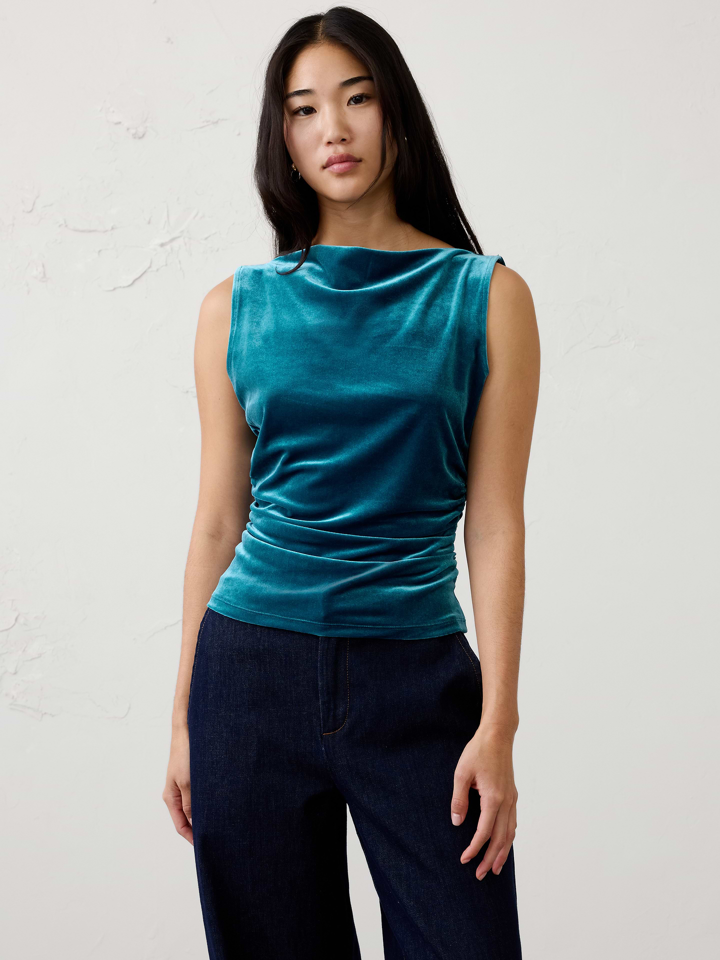Image 1 of 4, Made from our ultra‑soft knit velvet, this top combines luxurious texture with effortless comfort. Side ruching creates a flattering, shape‑enhancing fit, while the rich velvet finish makes it the perfect piece to elevate your festive wardrobe., Straight neckline. Sleeveless., Side shirring at waist., Fitted at the waist., Made exclusively for Banana Republic Factory., Product #1186014