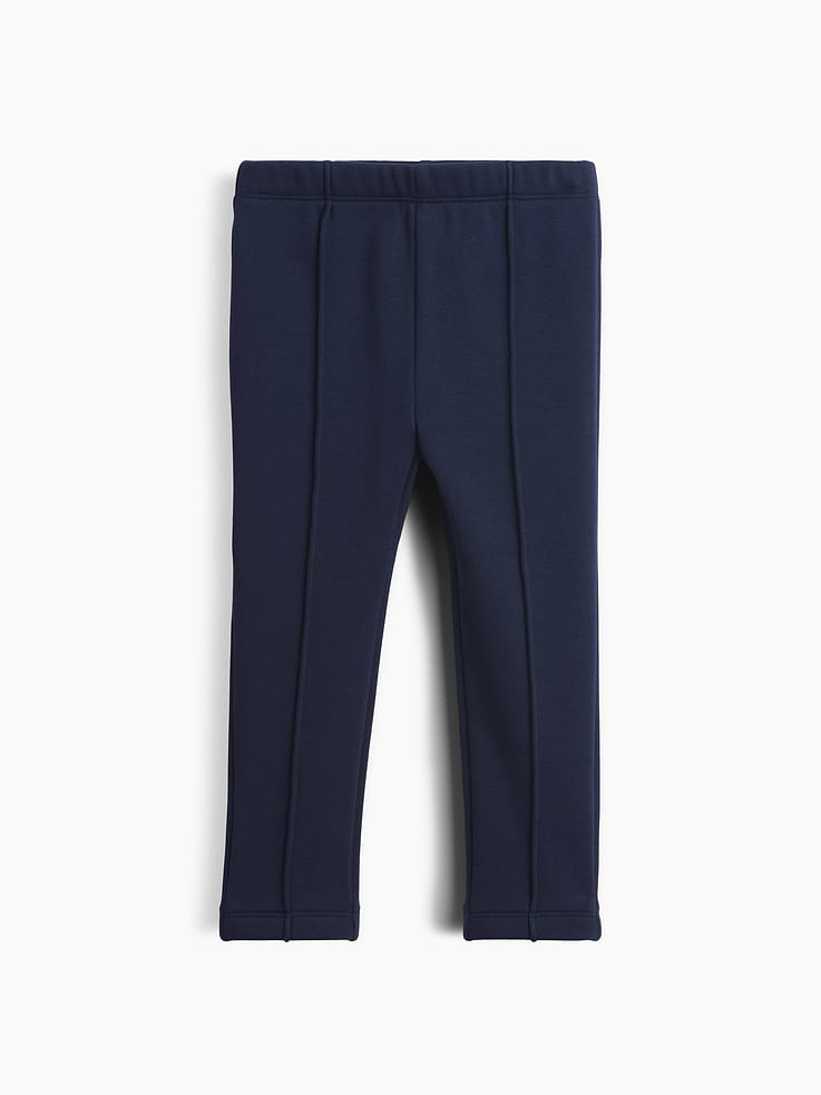 Image 1 of 4, Soft, stretch knit leggings with a cozy sherpa lining., Elasticized waist., Pintuck detailing at front., Made with 37% recycled polyester. Compared to virgin materials, using recycled materials helps reduce resource use and waste., This product was made in a factory that invests in gender equity and women’s empowerment through RISE. Learn more at gapinc.com/equity ., Product #1184974