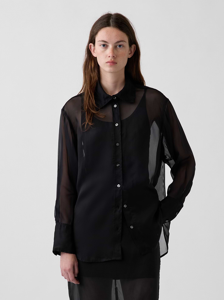 Image 1 of 4, Our oversized shirt pulled straight from the archives. Always easy. Forever iconic., Sheer organza oversized shirt., Point collar, button front., Long sleeves with button cuffs., This product was made in a factory that invests in gender equity and women’s empowerment through RISE. Learn more at gapinc.com/equity ., Product #1184603