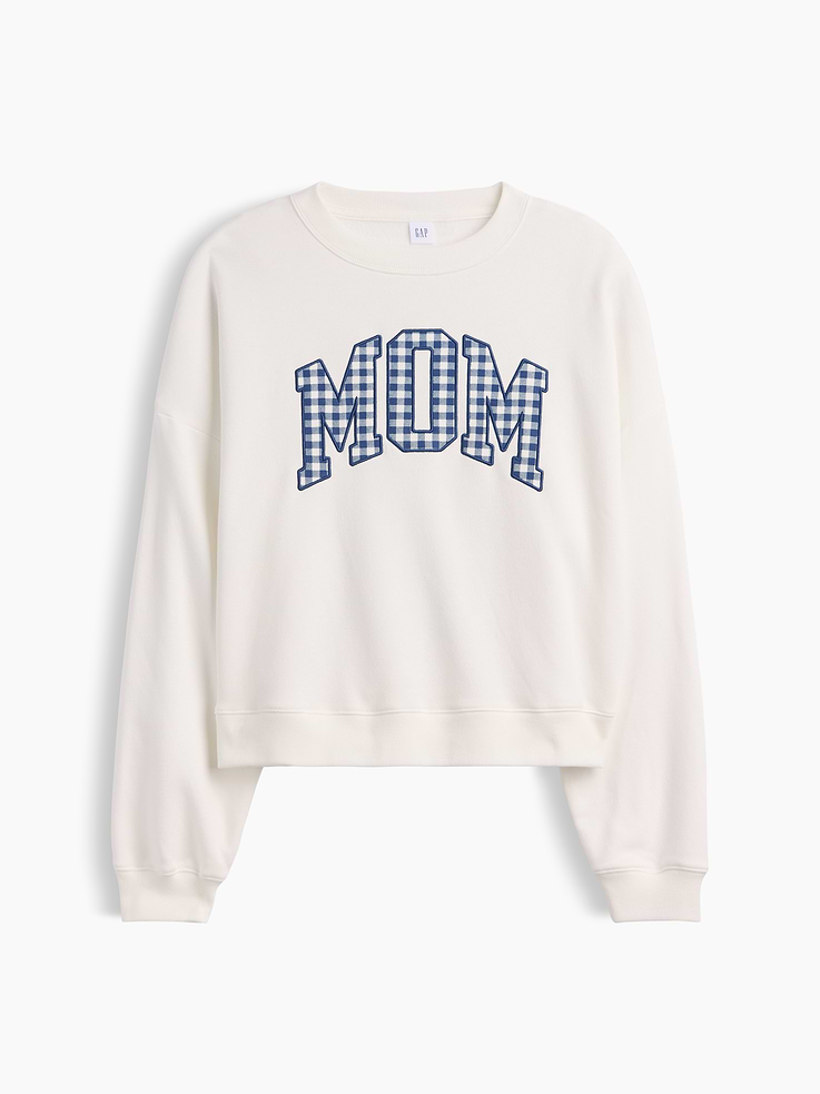 Image 1 of 2, This product is made with/contains 23% recycled polyester. Compared to virgin materials, using recycled materials helps reduce resource use and waste., Soft, comfy fleece., Dropped shoulder, long sleeves with banded cuffs., Crewneck., Mom graphic at front, Gap logo at sleeve., Banded wedge hem., This product was made in a factory that invests in gender equity and women’s empowerment through RISE. Learn more at gapinc.com/equity., Product #1173155