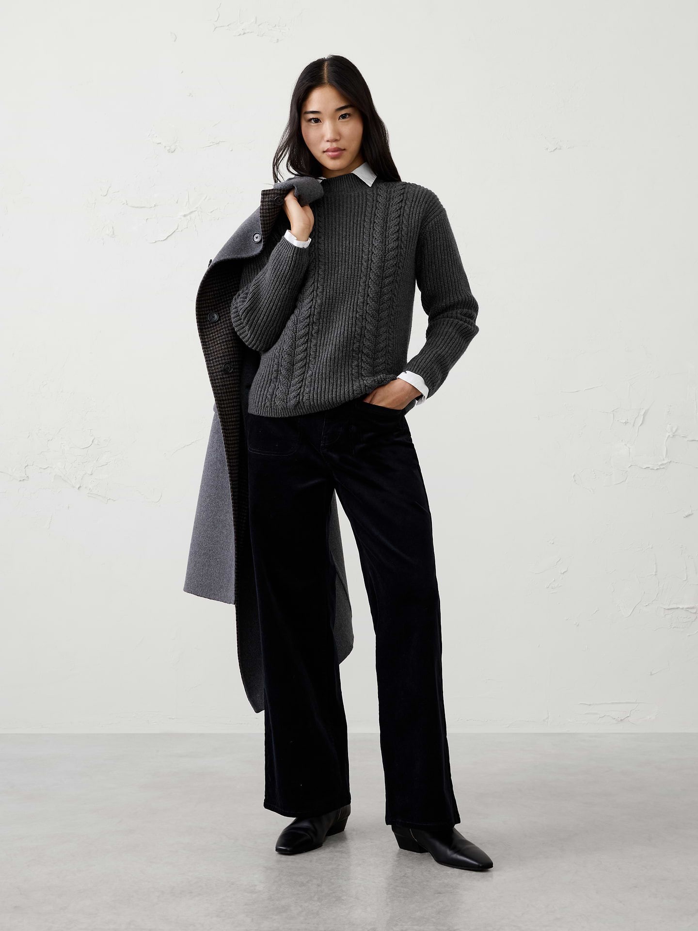 Image 1 of 4, Our sweater is knit from our signature Perfectly Soft yarn—a luxurious blend of cotton with a hint of wool, that feels as cozy as it looks. Classic cable stitching adds timeless texture and dimension, elevating the silhouette with a heritage‑inspired touch., Mock neck. Long sleeves., Drop shoulders., Made exclusively for Banana Republic Factory., Product #1177060