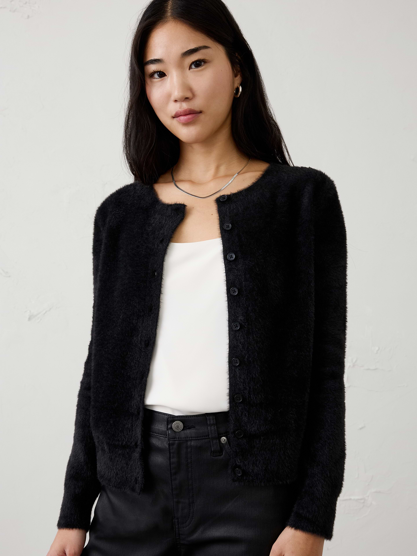 Image 1 of 4, Crafted from our signature eyelash yarn, this cardigan delivers an ultra‑soft, plush feel with a luxurious hand. The fuzzy texture adds rich dimension and cozy warmth, making it an effortless layering piece for cooler days., Crew neck. Long sleeves., Button‑front closure., Care suggestion: Use a low‑heat iron; steam as needed., Made exclusively for Banana Republic Factory., Product #1177061