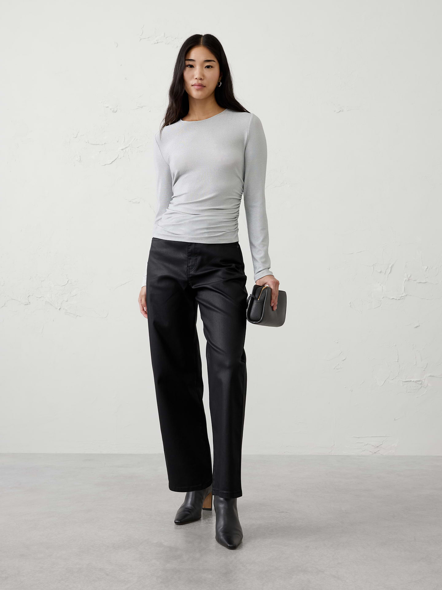 Image 1 of 4, Designed to shine without sacrificing comfort, this top features subtle side shirring for a flattering, shape‑enhancing fit. The soft sparkle knit is comfortable, itch‑free, and easy to wear, making it an effortless choice for holiday gatherings and special occasions., Crew neck. Long sleeves., Fitted at the waist., Shirring at side waist detailing., Made exclusively for Banana Republic Factory., Product #1186001