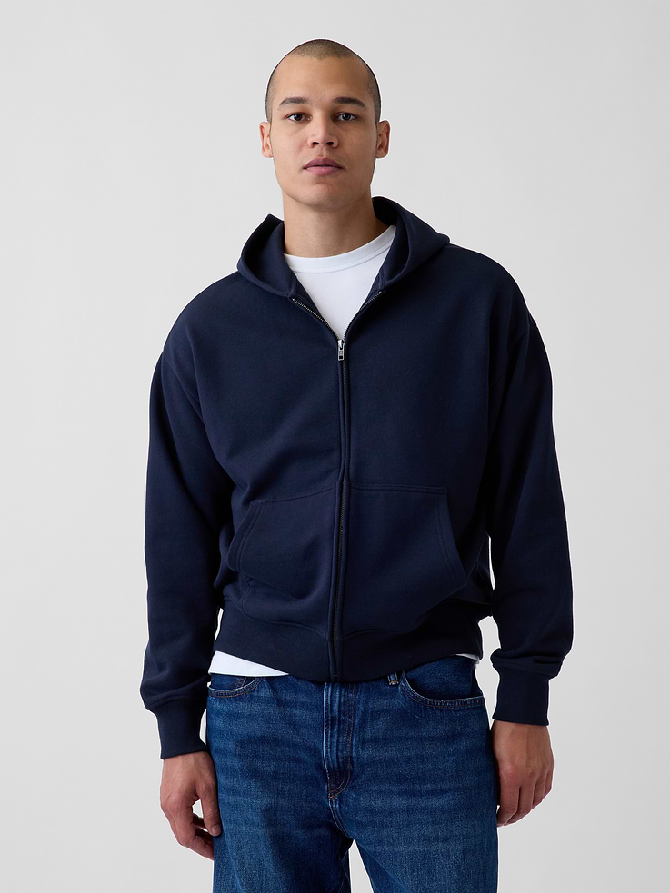 Image 1 of 5, Soft, heavyweight cotton-blend fleece hoodie., Hooded neckline., Long sleeves., Zipper front., Kanga pockets., Banded hem., Made with 14% recycled polyester. Compared to virgin materials, using recycled materials helps reduce resource use and waste., Explore our GapSweats Guide ., This product was made in a factory that invests in gender equity and women’s empowerment through RISE. Learn more at gapinc.com/equity ., Product #821295