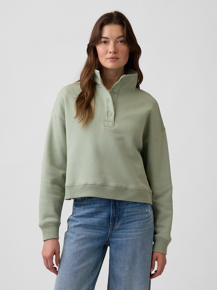 Image 1 of 5, This product is made with/contains 23% recycled polyester. Compared to virgin materials, using recycled materials helps reduce resource use and waste., Soft, comfy fleece., Dropped shoulder, long sleeves with banded cuffs., Stand collar, henley button front., Banded hem., This product was made in a factory that invests in gender equity and women’s empowerment through RISE. Learn more at, Product #1191168