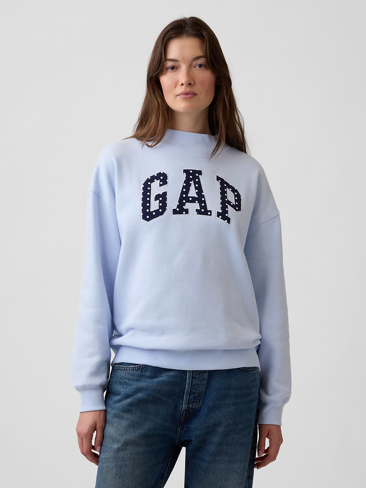 Image 1 of 5, This style is made with 23% recycled polyester. Compared to virgin materials, using recycled materials helps to reduce resource use and waste., Soft, comfy fleece., Dropped shoulder, long sleeves with banded cuffs., Mockneck., Gap logo at front., Banded hem., Product #1174684