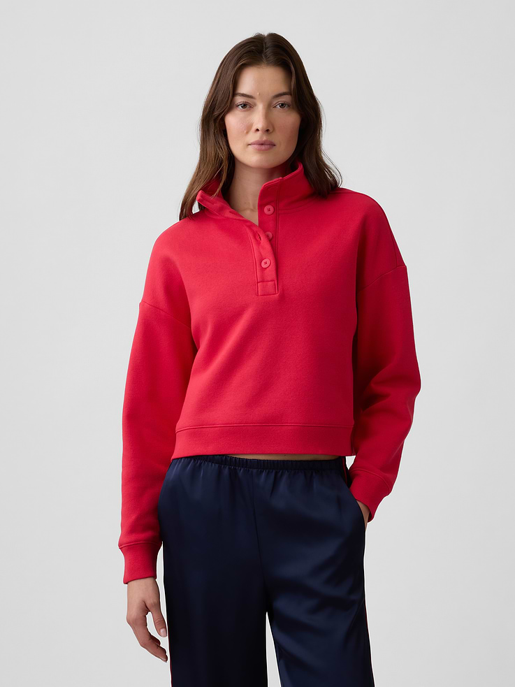 Image 1 of 5, This product is made with/contains 23% recycled polyester. Compared to virgin materials, using recycled materials helps reduce resource use and waste., Soft, comfy fleece., Dropped shoulder, long sleeves with banded cuffs., Stand collar, henley button front., Banded hem., This product was made in a factory that invests in gender equity and women’s empowerment through RISE. Learn more at, Product #1191168