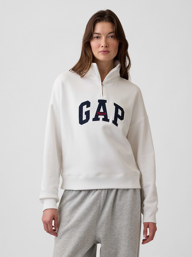 Image 1 of 5, This product is made with/contains 23% recycled polyester. Compared to virgin materials, using recycled materials helps reduce resource use and waste., Soft, comfy fleece., Dropped shoulder, long sleeves with banded cuffs., Mockneck, half-zip front., Gap logo at front., Banded hem., Product #1195242