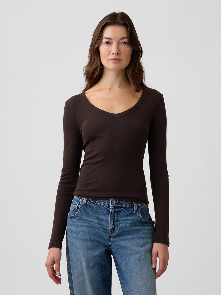 Image 1 of 5, Soft ribbed knit., Long sleeves., V-neck., Select styles have allover print or stripes., This product was made in a factory that invests in gender equity and women’s empowerment through RISE. Learn more at, Product #1179572