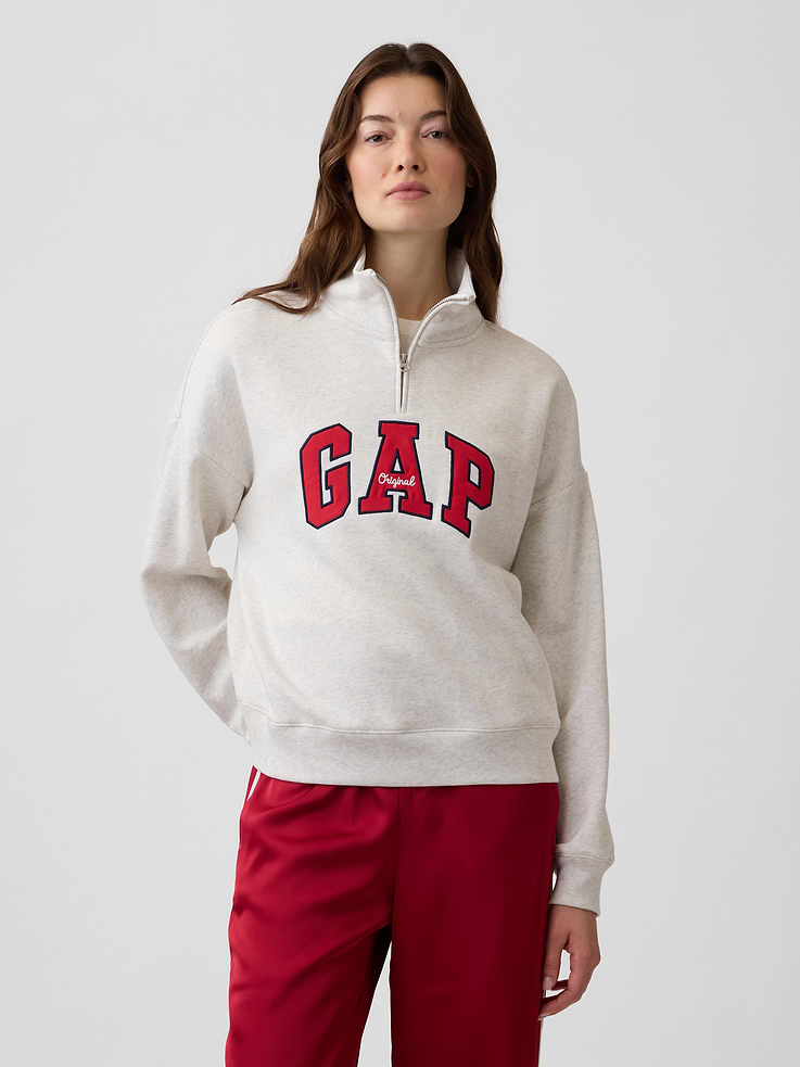 Image 1 of 5, This product is made with/contains 23% recycled polyester. Compared to virgin materials, using recycled materials helps reduce resource use and waste., Soft, comfy fleece., Dropped shoulder, long sleeves with banded cuffs., Mockneck, half-zip front., Gap logo at front., Banded hem., Product #1195242