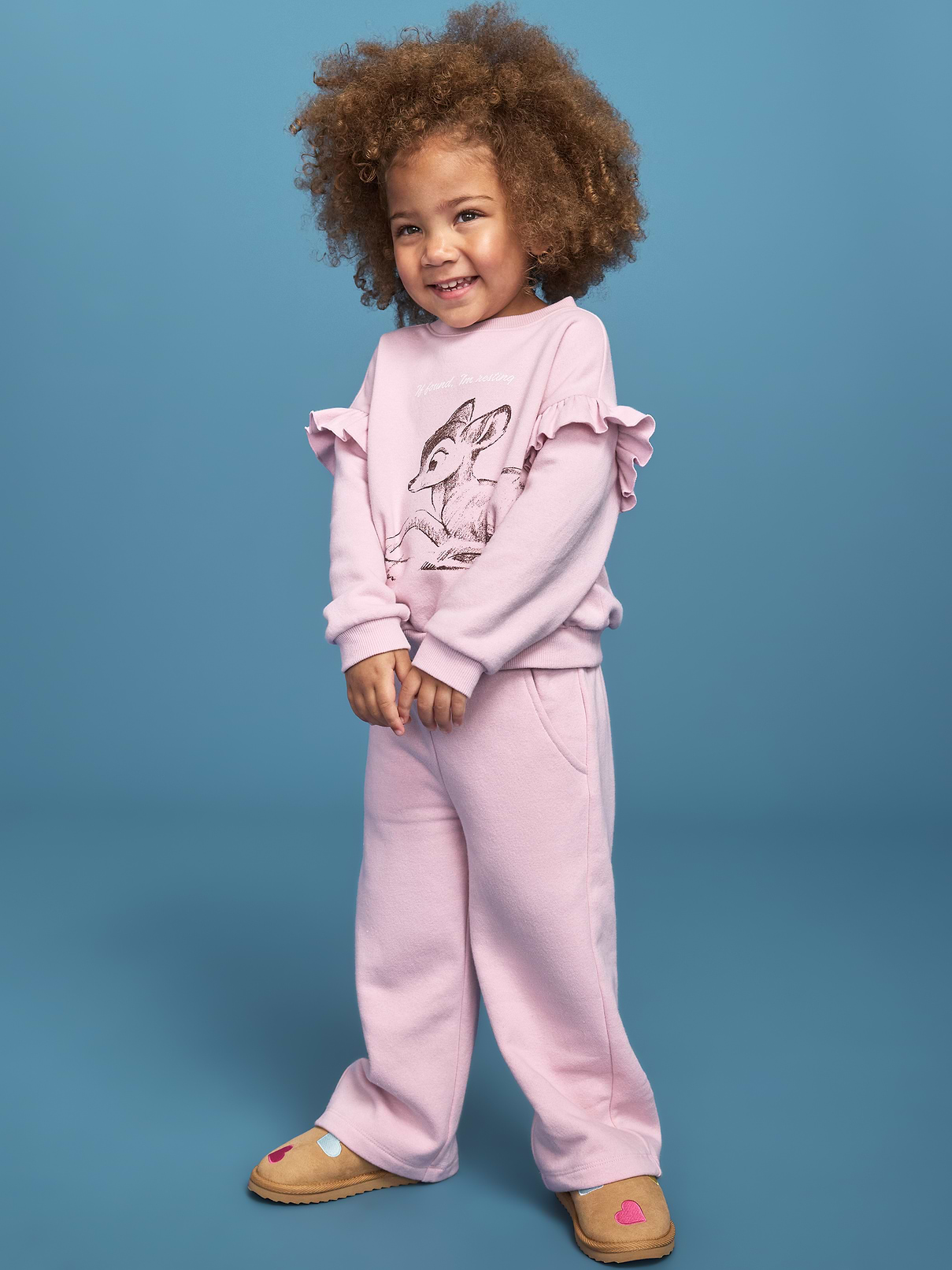 Image 1 of 4, crew neck, long sleeves, ruffle trim along shoulders, matching sweatpants, elasticized waistband, licensed graphic, ©Disney, Product #1184916