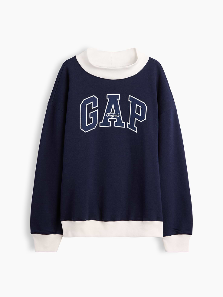 Image 1 of 2, This product is made with/contains 23% recycled polyester. Compared to virgin materials, using recycled materials helps reduce resource use and waste., Soft, comfy fleece., Dropped shoulder, long sleeves with banded cuffs., Mockneck., Gap logo at front., Banded hem., Allover colorblocking., Product #1195403