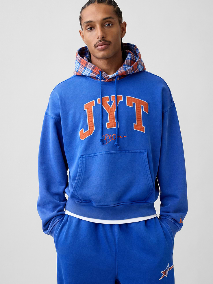 Image 1 of 9, Soft, heavyweight fleece hoodie. In an oversized fit., Hooded neckline with drawcords., Long sleeves with dropped shoulders., Kanga pocket., JYT arch logo and graphics., Banded hem and cuffs., Made with 14% recycled polyester. Compared to virgin materials, using recycled materials helps reduce resource use and waste., Product #1196141