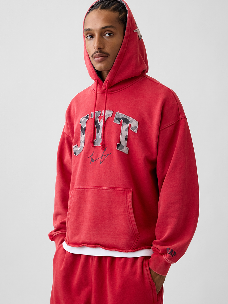 Image 1 of 10, Soft, heavyweight fleece hoodie. In an oversized fit., Hooded neckline with drawcords., Long sleeves with dropped shoulders and banded cuffs., JYT embroidered arch logo and graphics., Kanga pocket., Raw hem., Made with 14% recycled polyester. Compared to virgin materials, using recycled materials helps reduce resource use and waste., Product #1196051
