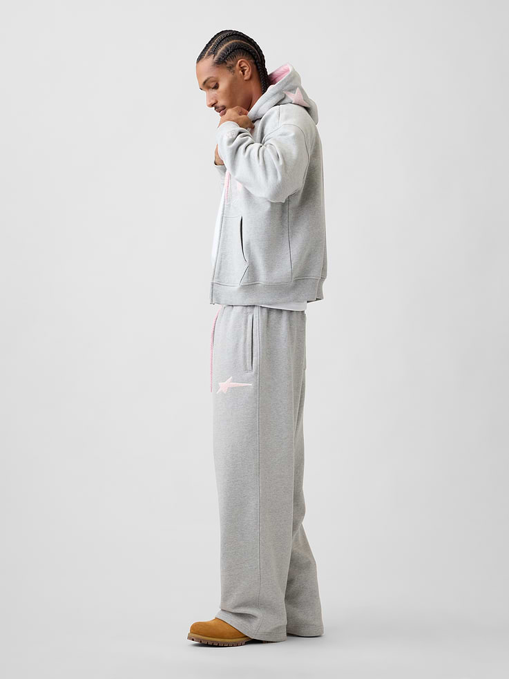 Image 1 of 9, Soft, heavyweight fleece sweatpants. In a baggy fit., Elasticized waist with drawcords., Slant pockets, back patch pocket., Embroidered star at thigh., Made with 14% recycled polyester. Compared to virgin materials, using recycled materials helps reduce resource use and waste., Product #1196147