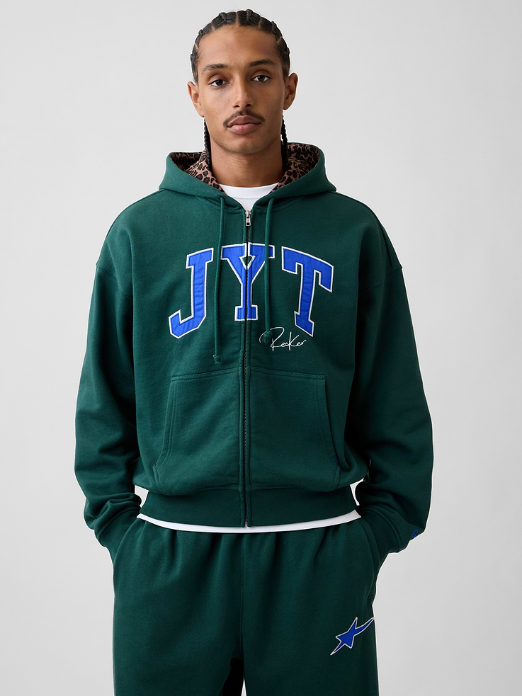 Image 1 of 10, Soft, heavyweight fleece hoodie. In an oversized fit., Hooded neckline with drawcords., Long sleeves with dropped shoulders., Zipper closure., Kanga pockets., JYT arch logo and graphics., Made with 14% recycled polyester. Compared to virgin materials, using recycled materials helps reduce resource use and waste., Product #1196143
