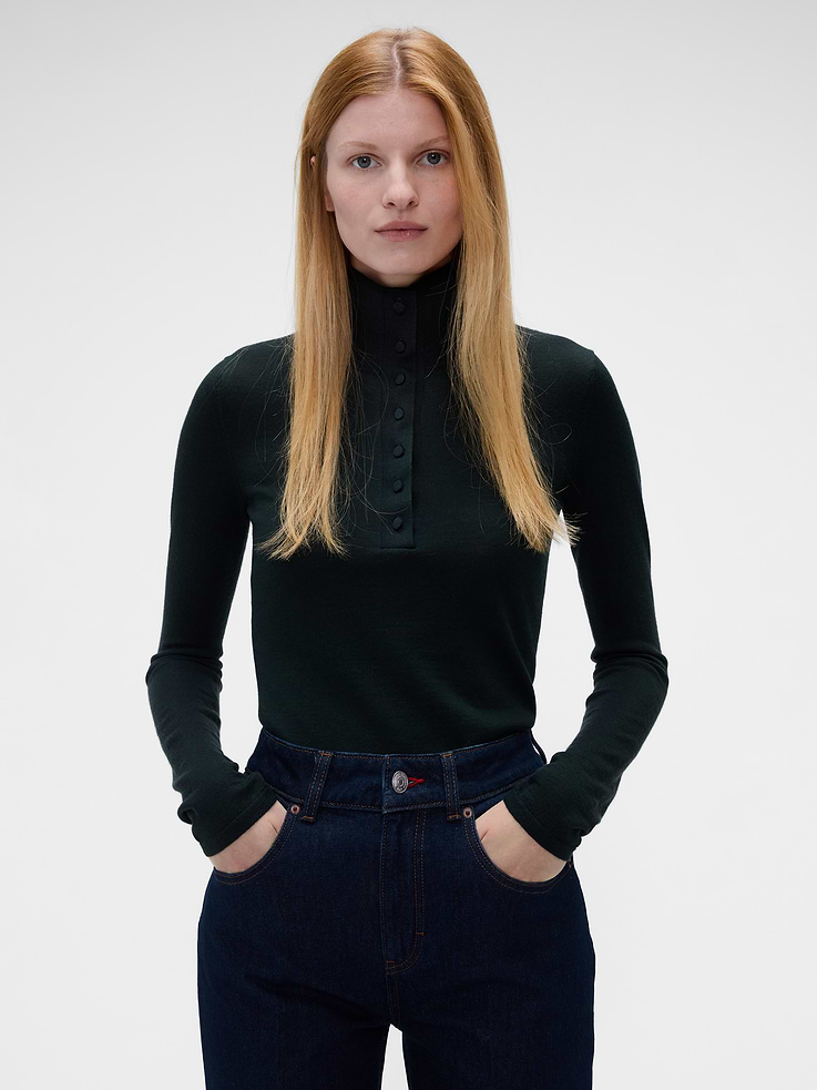Image 1 of 6, Soft Merino wool sweater. In a slim fit., Turtleneck with button detailing., Long sleeves., Ribbed hem and cuffs., This product contains 100% RWS-certified wool, certified by Control Union (CU 893801), which verifies animal welfare and land management requirements and tracks the certified wool fiber from farm to final product., This product was made in a factory that invests in gender equity and women’s empowerment through RISE. Learn more at gapinc.com/equity ., Product #1183572