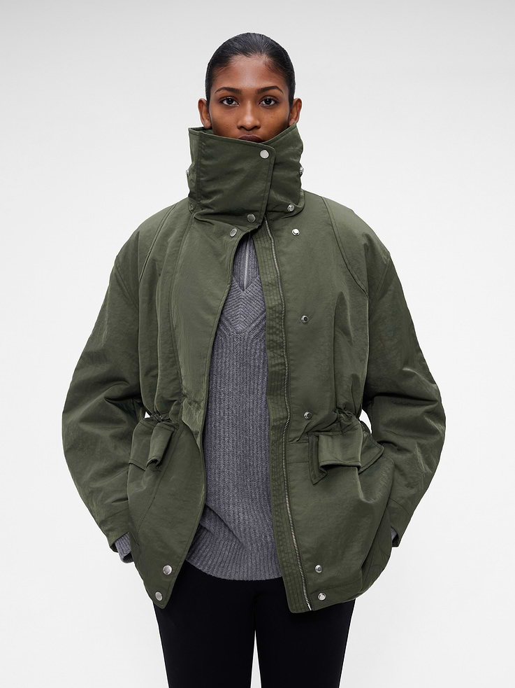 Image 1 of 9, Wind-resistant and water-repellent crinkle nylon twill parka jacket., Quilted taffeta lining., High neck., Long sleeves with dropped shoulders., Hidden zipper under snap button closure., Cinch cord at waist., Flap pockets., Double layered hem., Product #1185645