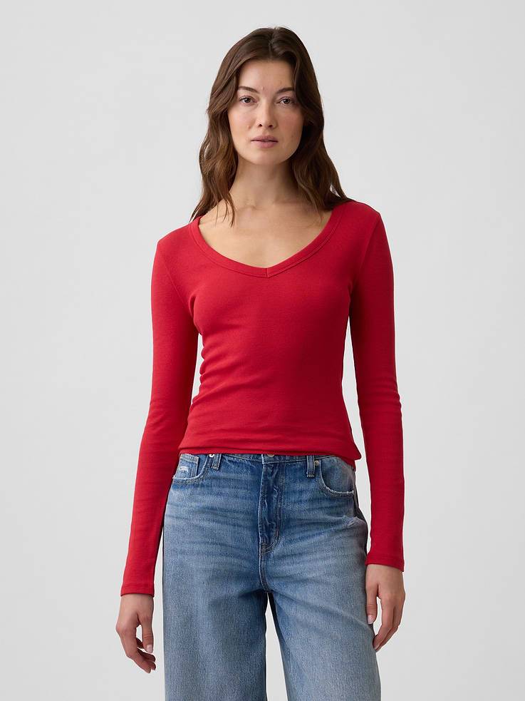 Image 1 of 5, Soft ribbed knit., Long sleeves., V-neck., Select styles have allover print or stripes., This product was made in a factory that invests in gender equity and women’s empowerment through RISE. Learn more at, Product #1179572